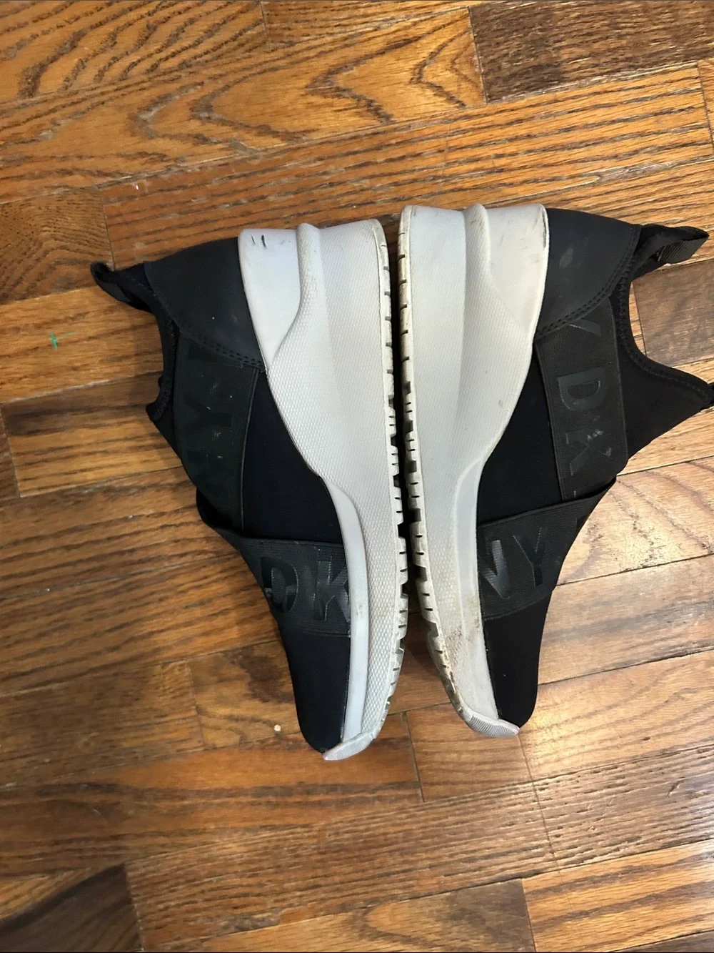 DKNY Black Slip-On Logo-Trim Women’s Sneakers with White Sole